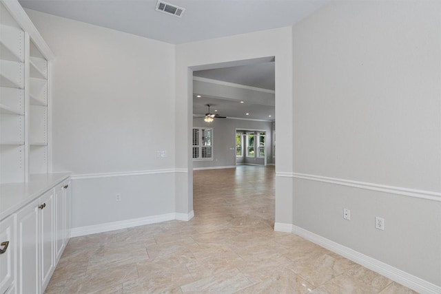282 Trail Of The Flowers, Georgetown, TX 78633 - unfurnished room with ceiling fan, baseboards, light marble finish flooring, and ornamental molding
