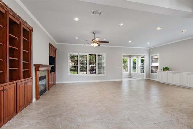 282 Trail Of The Flowers, Georgetown, TX 78633 - unfurnished living room with ceiling fan, a glass covered fireplace, crown molding, recessed lighting, and baseboards