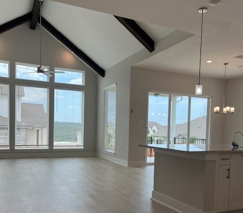 6200 Alamosa Clearing Dr, Austin, TX 78738 - kitchen with baseboards, healthy amount of natural light, light wood-style flooring, ceiling fan, and recessed lighting