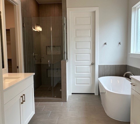 6200 Alamosa Clearing Dr, Austin, TX 78738 - full bath with vanity, a shower stall, and a freestanding tub