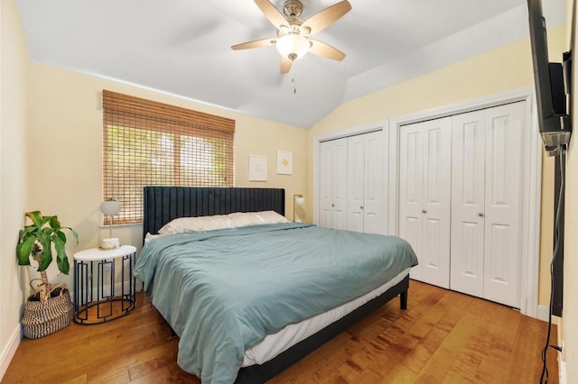 111 Adam L Chapa Sr St, Austin, TX 78702 - bedroom featuring multiple closets, wood finished floors, lofted ceiling, a ceiling fan, and baseboards