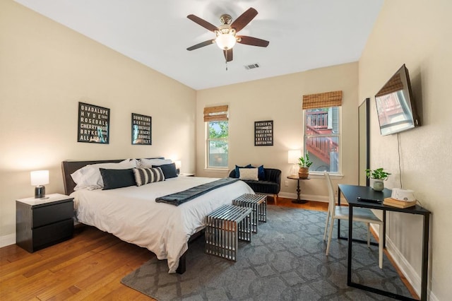111 Adam L Chapa Sr St, Austin, TX 78702 - bedroom with wood finished floors, baseboards, and a ceiling fan