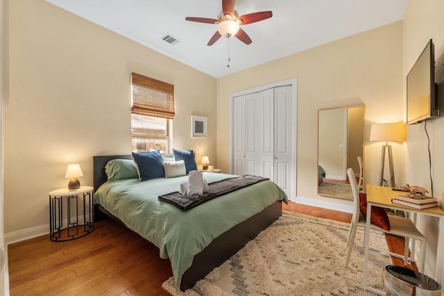 111 Adam L Chapa Sr St, Austin, TX 78702 - bedroom featuring a closet, baseboards, wood finished floors, and a ceiling fan
