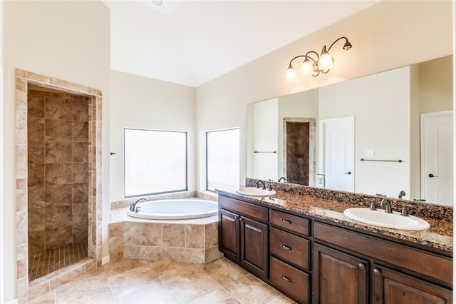 159 Catfish Cv, Dripping Springs, TX 78620 - bathroom with a garden tub, double vanity, tiled shower, and tile patterned floors