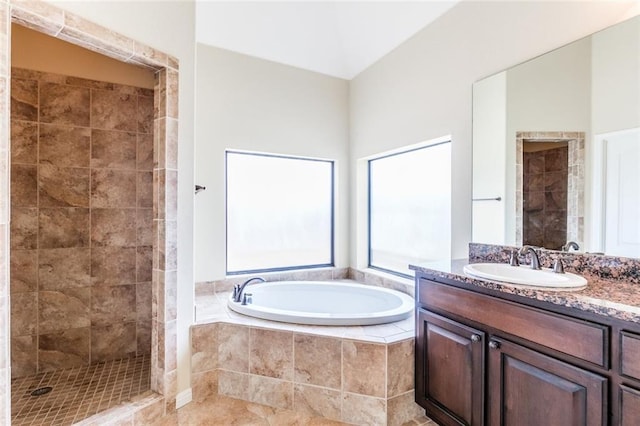 159 Catfish Cv, Dripping Springs, TX 78620 - bathroom featuring a garden tub, vanity, and a tile shower