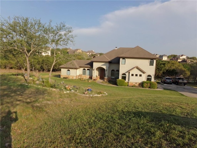 159 Catfish Cv, Dripping Springs, TX 78620 - view of front of house with a front lawn and stucco siding