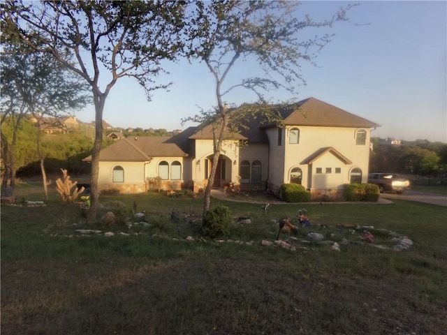 159 Catfish Cv, Dripping Springs, TX 78620 - view of front of house with a front yard and stucco siding