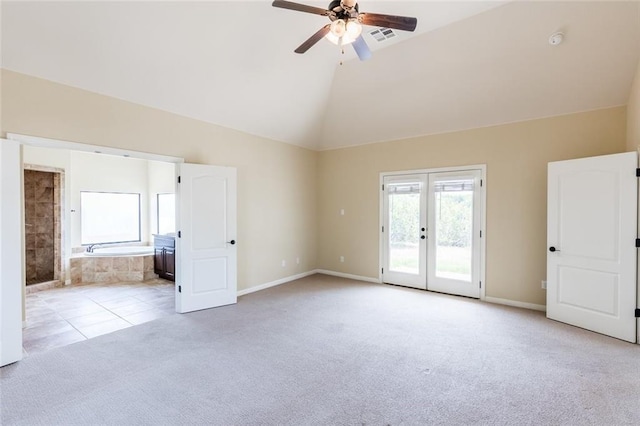 159 Catfish Cv, Dripping Springs, TX 78620 - empty room with carpet flooring, ceiling fan, high vaulted ceiling, french doors, and baseboards