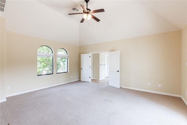 159 Catfish Cv, Dripping Springs, TX 78620 - unfurnished bedroom with light colored carpet, high vaulted ceiling, baseboards, and a ceiling fan