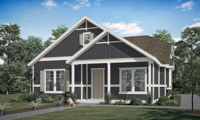 8606 Dongan Dr, Austin, TX 78744 - view of front of property featuring a front yard, a shingled roof, and a porch