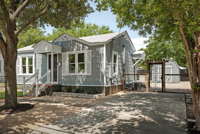 5306 Harmon Ave, Austin, TX 78751 - view of front of house featuring entry steps and central AC unit