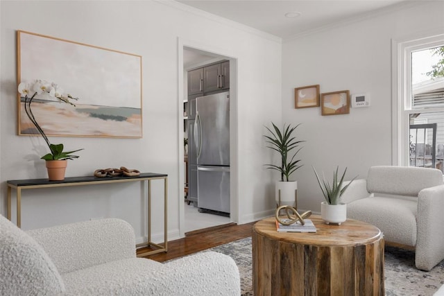5306 Harmon Ave, Austin, TX 78751 - living area with light wood-style flooring, crown molding, and baseboards