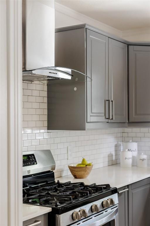 5306 Harmon Ave, Austin, TX 78751 - kitchen featuring gas range, gray cabinetry, extractor fan, and light countertops