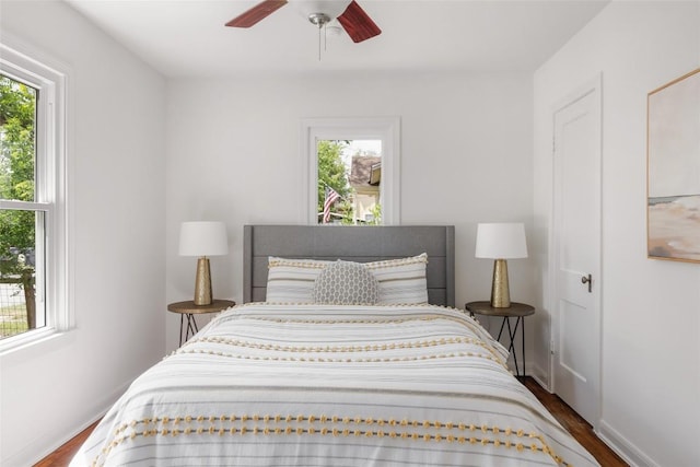 5306 Harmon Ave, Austin, TX 78751 - bedroom with multiple windows, dark wood-style floors, and ceiling fan