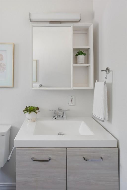 5306 Harmon Ave, Austin, TX 78751 - bathroom featuring vanity and toilet