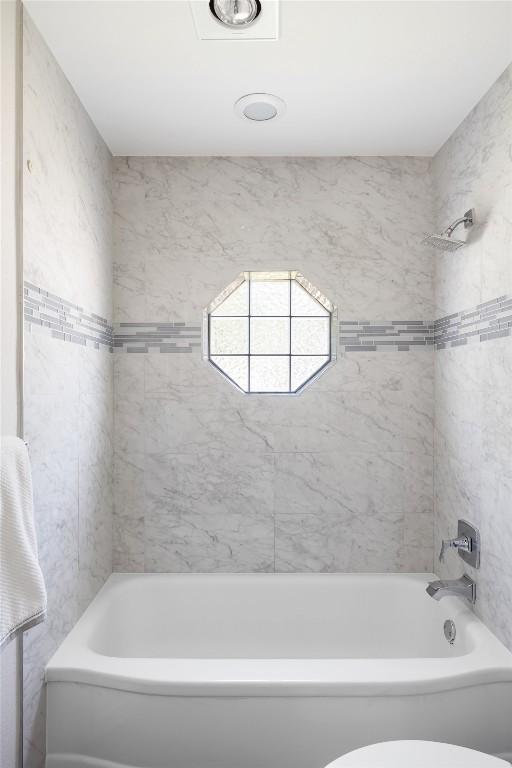 5306 Harmon Ave, Austin, TX 78751 - bathroom with washtub / shower combination and toilet