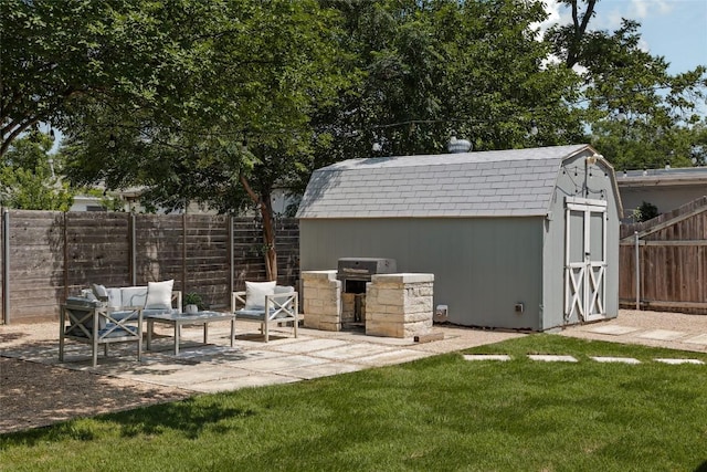 5306 Harmon Ave, Austin, TX 78751 - fenced backyard featuring a patio area, a storage unit, and a grill