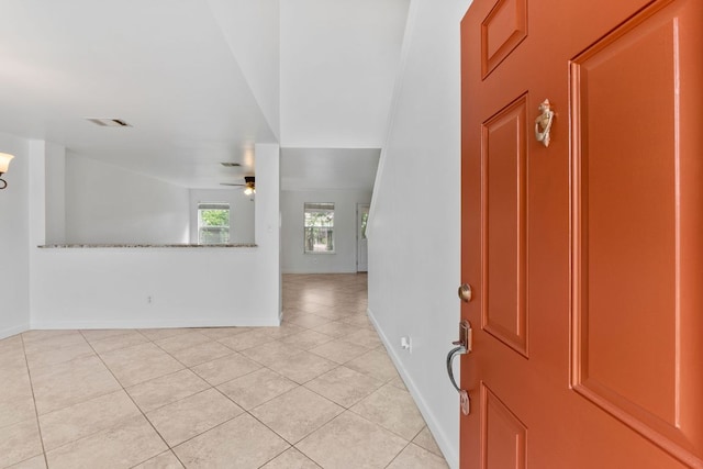 18109 Canopy Ln, Manor, TX 78653 - foyer entrance with ceiling fan, light tile patterned floors, and baseboards