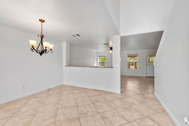 18109 Canopy Ln, Manor, TX 78653 - spare room featuring a ceiling fan, a chandelier, light tile patterned flooring, and baseboards