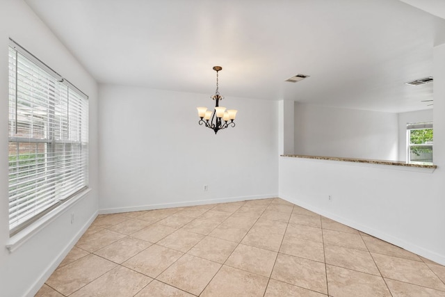 18109 Canopy Ln, Manor, TX 78653 - tiled spare room featuring a chandelier and baseboards
