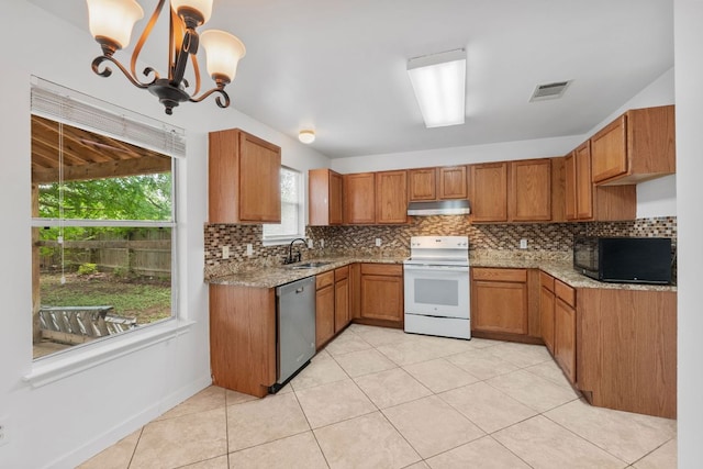 18109 Canopy Ln, Manor, TX 78653 - kitchen with white range with electric stovetop, black microwave, under cabinet range hood, a sink, and stainless steel dishwasher