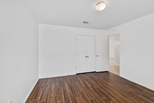 18109 Canopy Ln, Manor, TX 78653 - unfurnished bedroom featuring wood finished floors, a closet, and baseboards