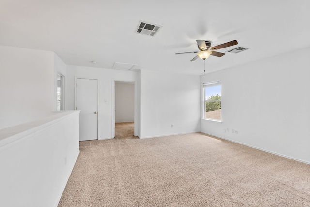 18109 Canopy Ln, Manor, TX 78653 - unfurnished room with ceiling fan, light carpet, baseboards, and attic access