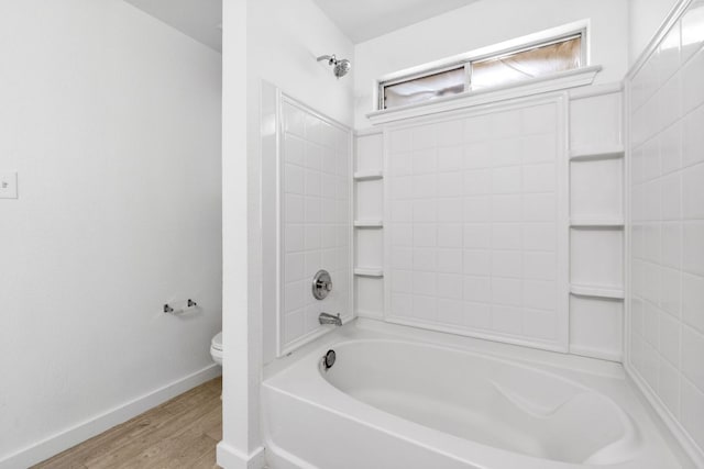 18109 Canopy Ln, Manor, TX 78653 - bathroom with toilet, wood finished floors, baseboards, and bathtub / shower combination