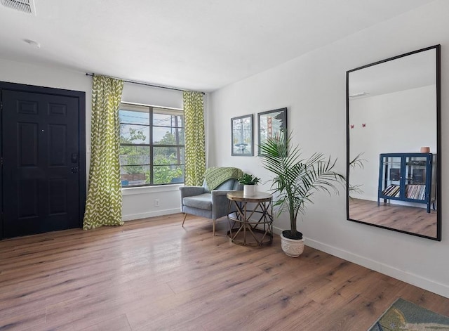 5206 Ledesma Rd, Austin, TX 78721 - sitting room with baseboards and wood finished floors