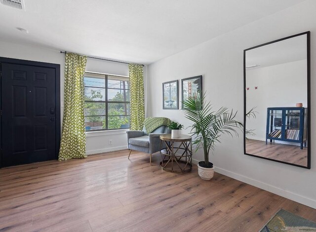 5206 Ledesma Rd, Austin, TX 78721 - living area with baseboards and wood finished floors