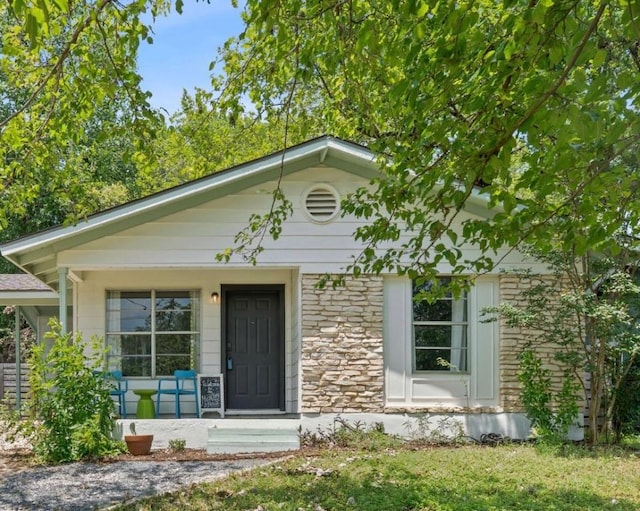 5206 Ledesma Rd, Austin, TX 78721 - view of front of property with stone siding and covered porch