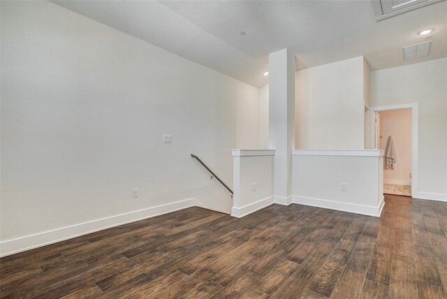 1801 Roseburg Dr Unit 29, Austin, TX 78754 - unfurnished room featuring dark wood finished floors, baseboards, recessed lighting, and lofted ceiling