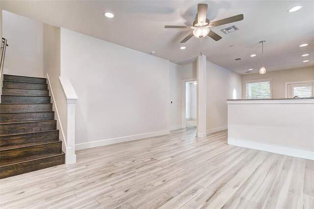 1801 Roseburg Dr Unit 29, Austin, TX 78754 - unfurnished living room featuring ceiling fan, light wood-type flooring, baseboards, recessed lighting, and stairway