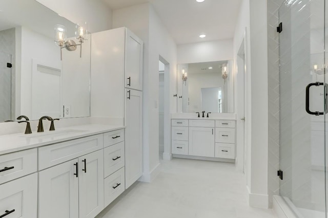 4300 Mansfield Dam Rd Unit 1231, Austin, TX 78734 - full bathroom with a shower stall, two vanities, recessed lighting, and baseboards