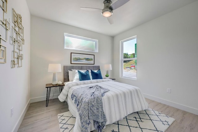 4300 Mansfield Dam Rd Unit 1231, Austin, TX 78734 - bedroom with baseboards, light wood-type flooring, and a ceiling fan