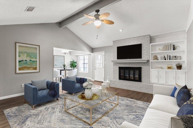 12103 Wycliff Ln, Austin, TX 78727 - living area featuring ceiling fan, wood finished floors, baseboards, a textured ceiling, and a fireplace