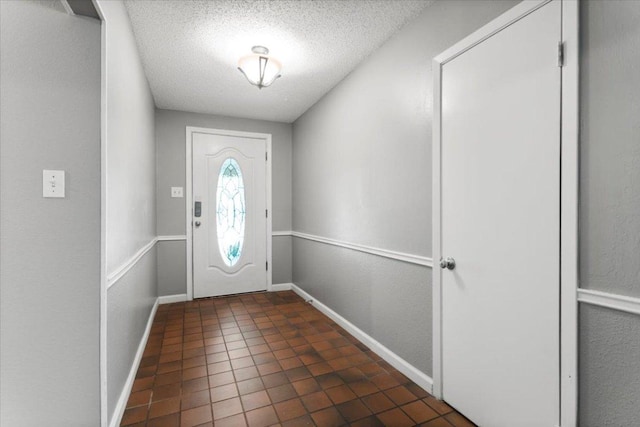 12103 Wycliff Ln, Austin, TX 78727 - entryway featuring a textured ceiling and baseboards
