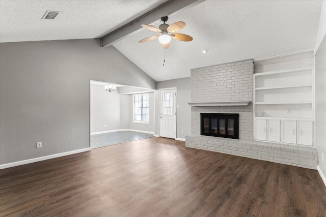 12103 Wycliff Ln, Austin, TX 78727 - unfurnished living room featuring ceiling fan, baseboards, wood finished floors, a textured ceiling, and a fireplace