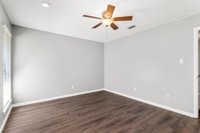 12103 Wycliff Ln, Austin, TX 78727 - spare room featuring ceiling fan, dark wood finished floors, and baseboards