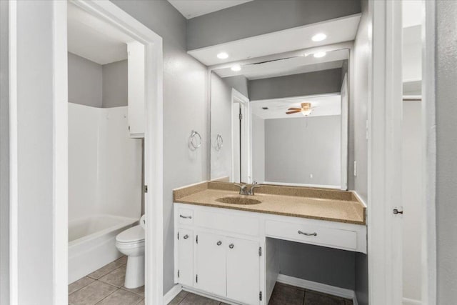 12103 Wycliff Ln, Austin, TX 78727 - bathroom with toilet, vanity, tile patterned floors, bathtub / shower combination, and ceiling fan