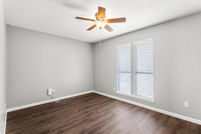 12103 Wycliff Ln, Austin, TX 78727 - unfurnished room with a ceiling fan, dark wood-style flooring, baseboards, and a textured ceiling