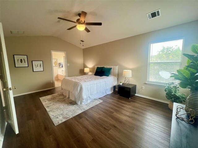144 Sampson, Kyle, TX 78640 - bedroom featuring dark wood finished floors, vaulted ceiling, baseboards, ceiling fan, and ensuite bath