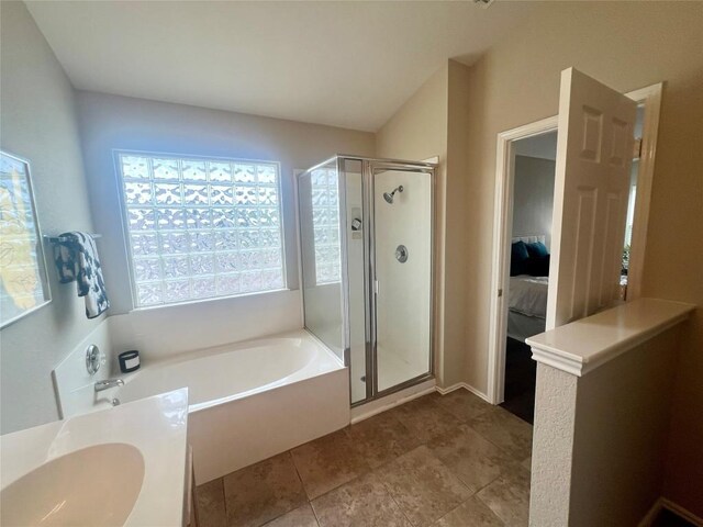 144 Sampson, Kyle, TX 78640 - full bathroom featuring a stall shower, a garden tub, plenty of natural light, and connected bathroom