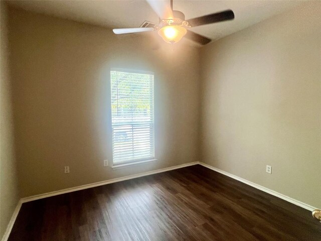 144 Sampson, Kyle, TX 78640 - empty room with dark wood-style flooring, baseboards, and a ceiling fan