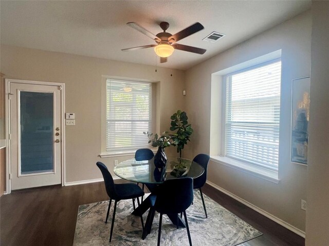 144 Sampson, Kyle, TX 78640 - dining room featuring wood finished floors, a ceiling fan, and baseboards