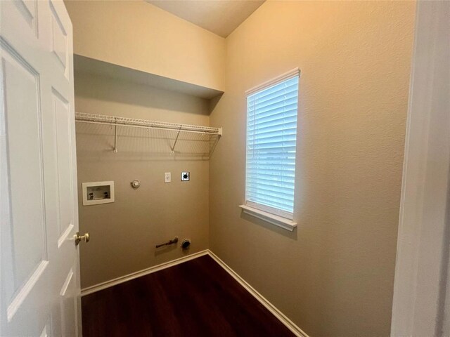 144 Sampson, Kyle, TX 78640 - washroom with electric dryer hookup, hookup for a gas dryer, dark wood-type flooring, baseboards, and washer hookup