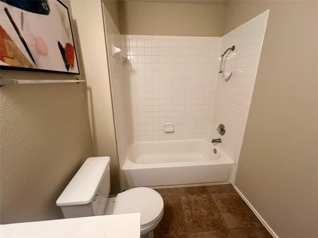 144 Sampson, Kyle, TX 78640 - bathroom featuring toilet, tub / shower combination, and baseboards