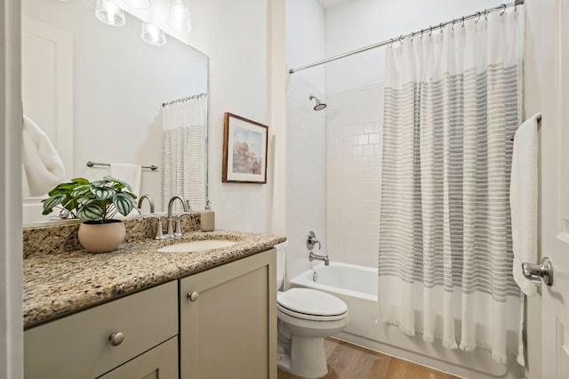 4048 Berkman Dr, Austin, TX 78723 - full bathroom featuring vanity, wood finished floors, toilet, and shower / bathtub combination with curtain