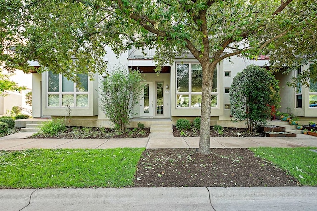 4048 Berkman Dr, Austin, TX 78723 - view of front of property featuring stucco siding and french doors