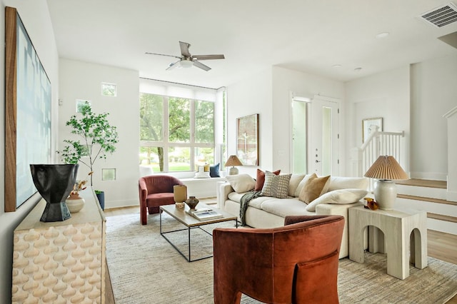 4048 Berkman Dr, Austin, TX 78723 - living room with a ceiling fan, light wood-type flooring, and baseboards